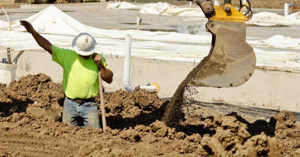 man in trench directing operations